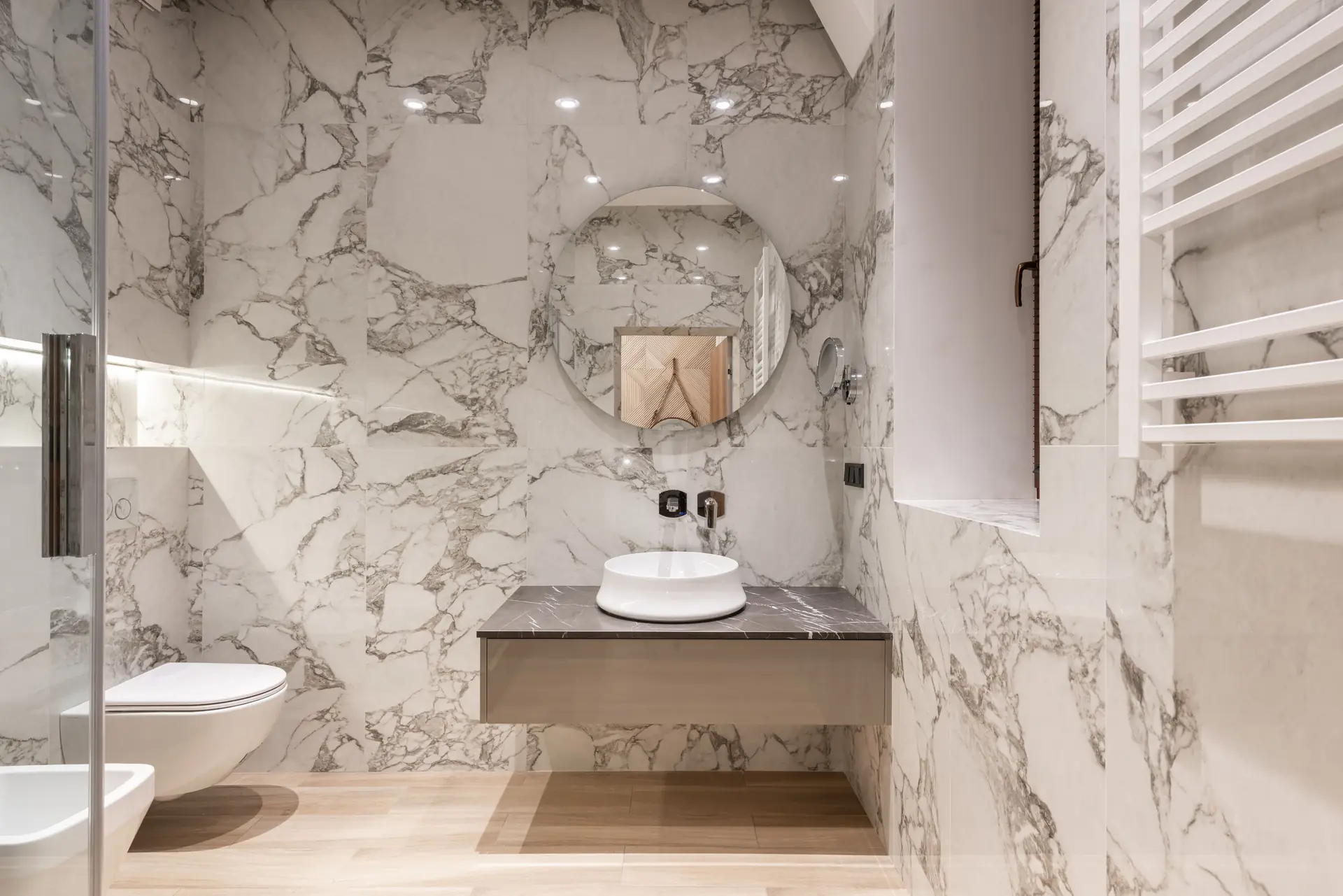 Bright bathroom clad in bold veined marble-look tiles